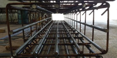 Prefabricated reinforcing cage made of cut and bent rebar for concrete column.